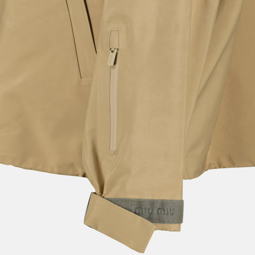 beige windbreaker, Miu Miu outerwear, spring-summer 2026 collection, technical polyester jacket, stylish windbreaker