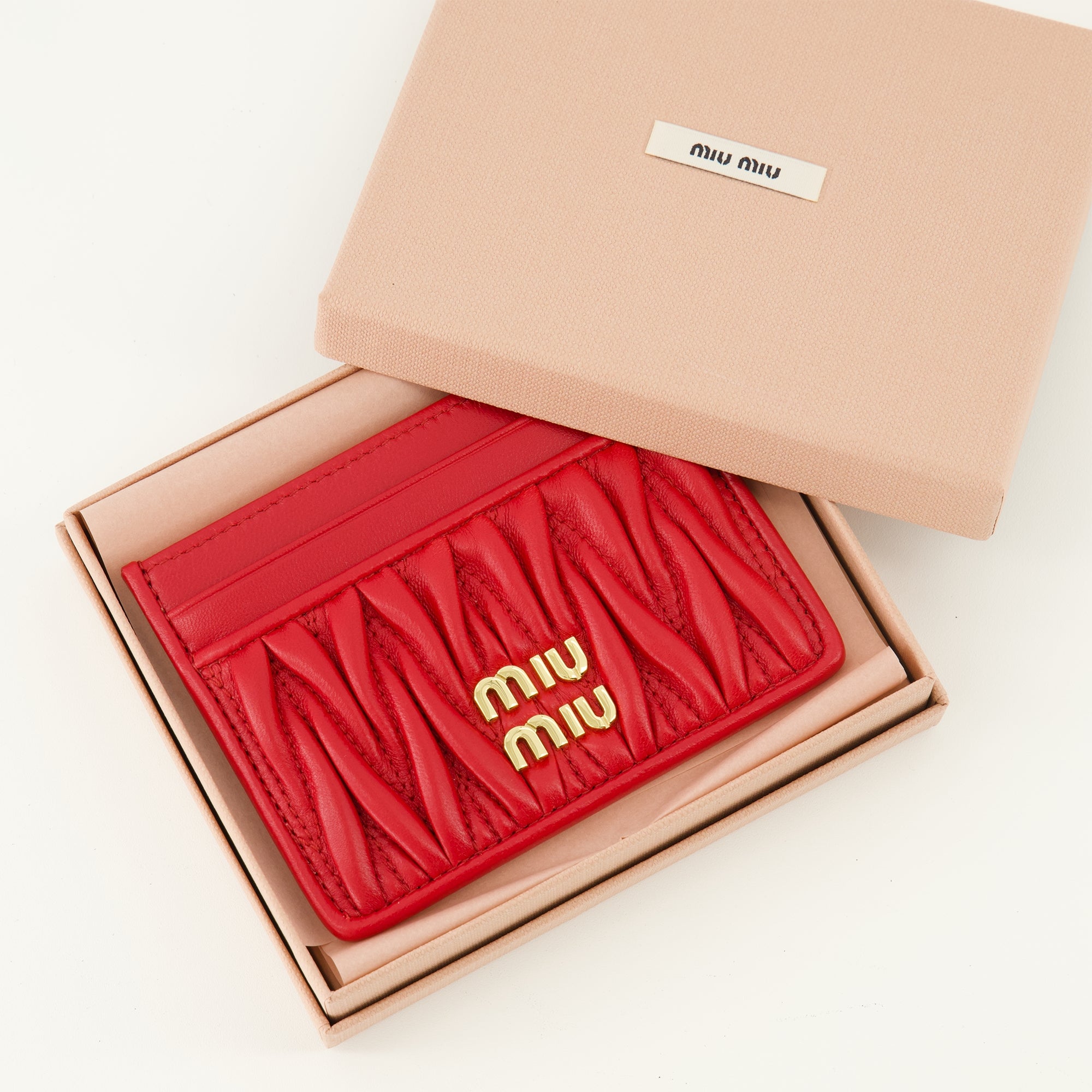 quilted leather card holder, Miu Miu accessories, red leather wallet, spring summer 2026, luxury leather goods