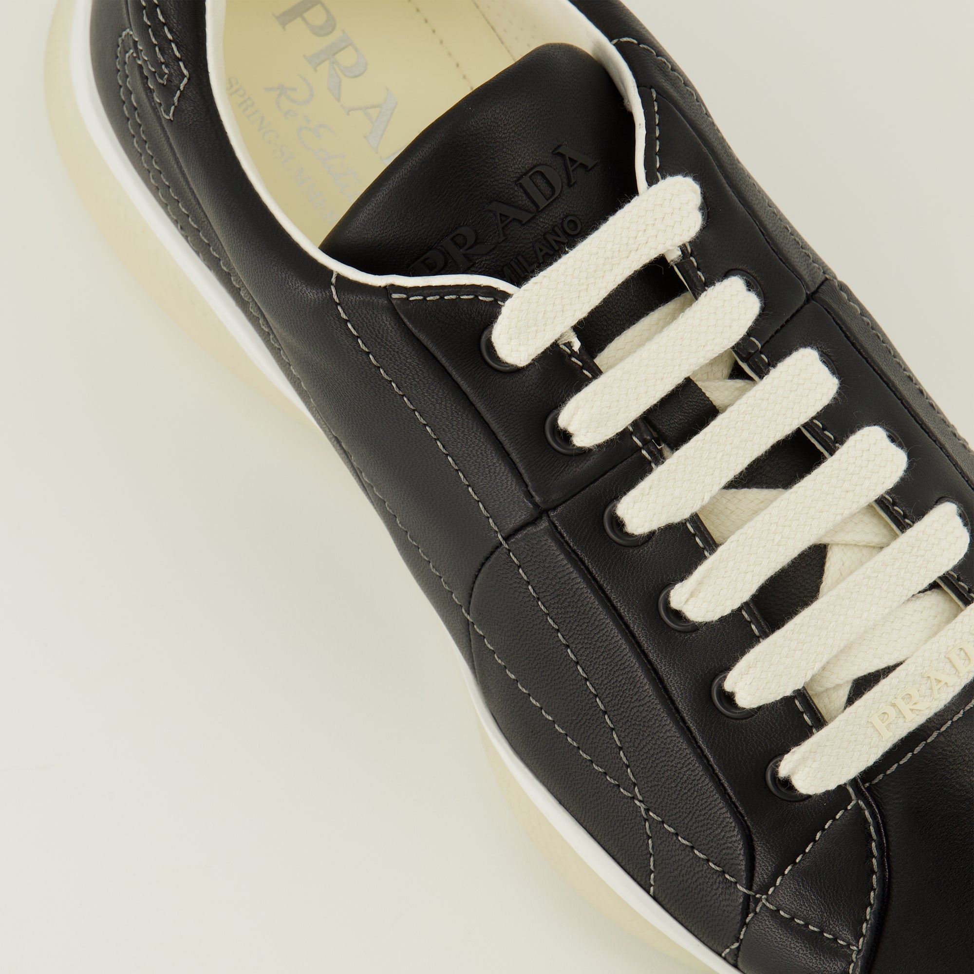 Prada sneakers, black leather footwear, comfort sneakers, rubber sole shoes, stylish lace-up shoes
