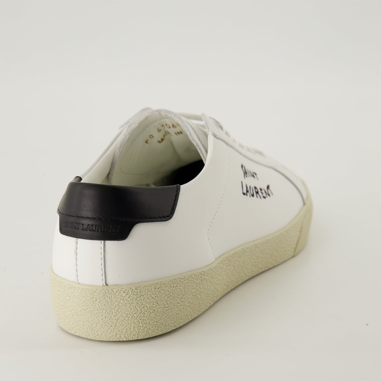 smooth leather sneakers, round toe design, gum sole sneakers, white leather sneakers, logo accent shoes