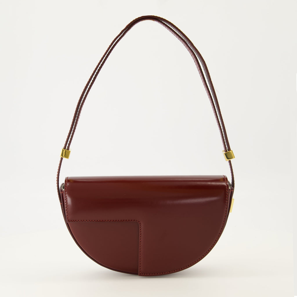 Le Petit Patou bag, bordeaux handbag, half-moon bag, high-quality leather bag, adjustable shoulder strap