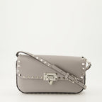 crossbody bag, gray leather bag, studded handbag, luxury accessory, designer handbag