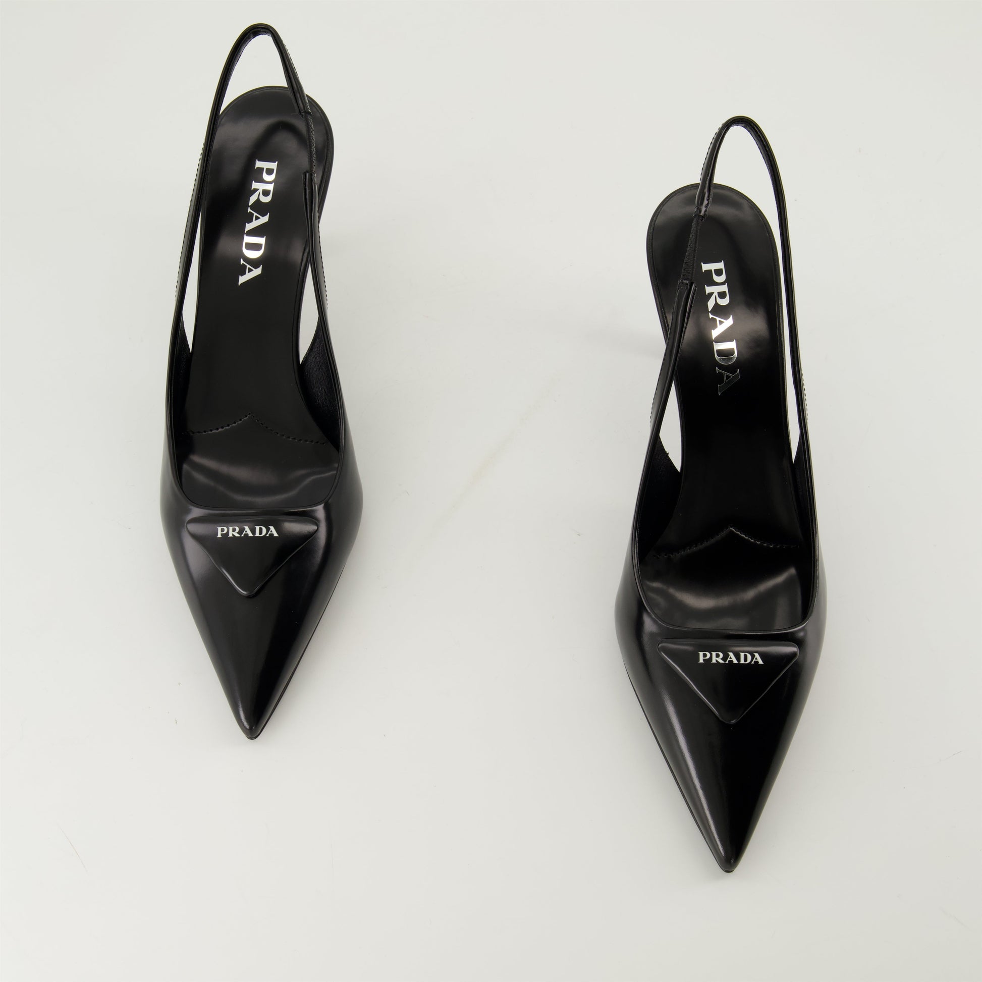 pointed toe pump, black leather shoe, Prada pump, elegant footwear, leather heel