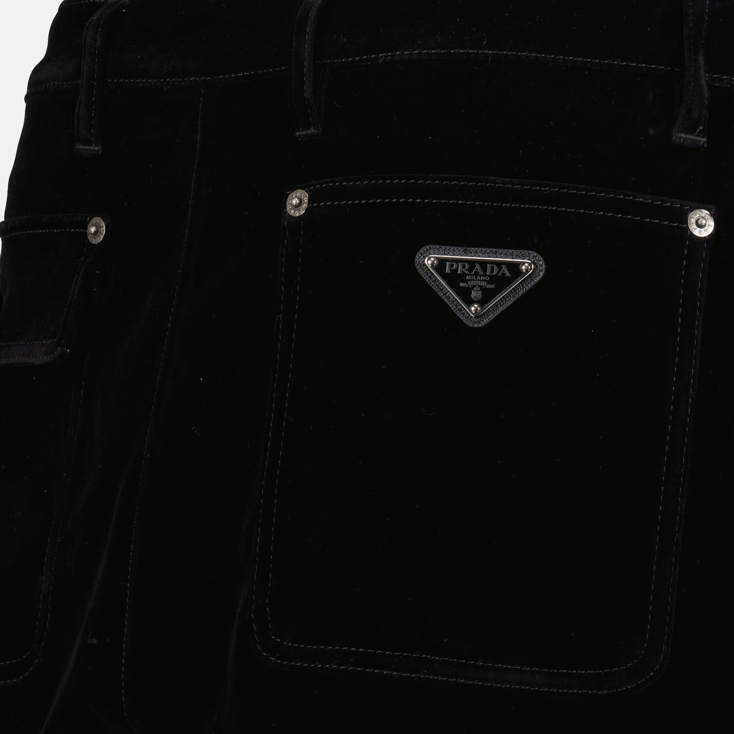 black denim jeans, wide-leg denim, enamel triangle logo, elegant denim, Spring-Summer 2025