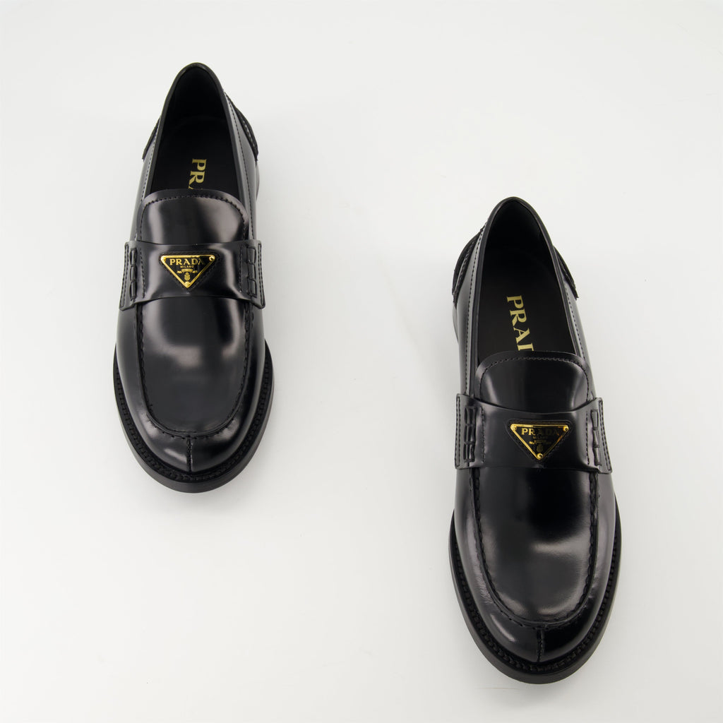 black leather moccasins, Prada footwear, brushed leather shoes, designer slip-ons, stylish moccasins