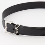black leather belt, YSL logo buckle, adjustable fit belt, sophisticated accessories, refined leather belt