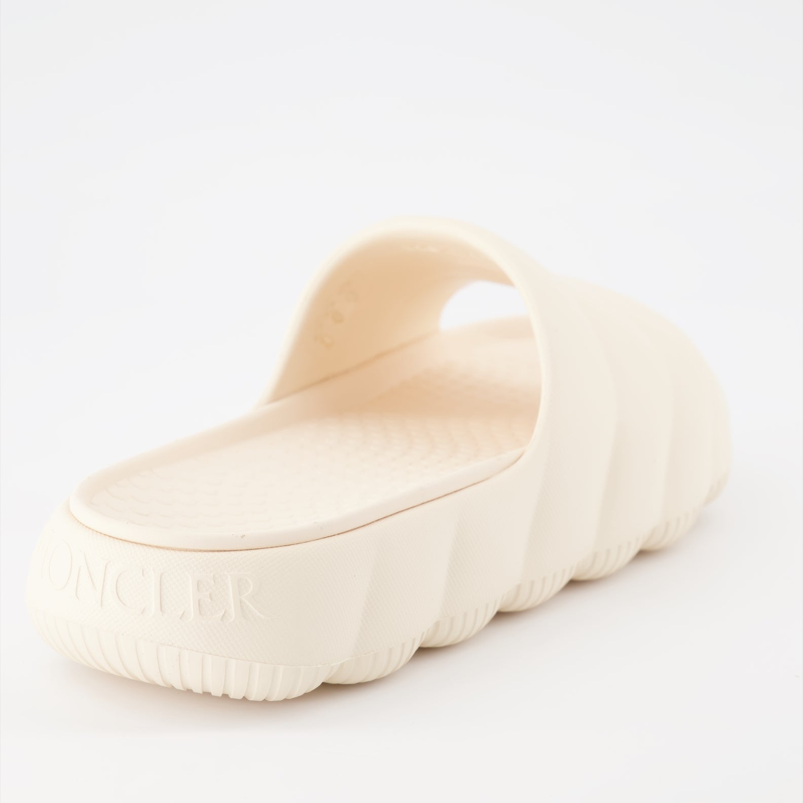 Moncler slides, luxury women's footwear, white slides, high-end fashion slides, designer casual shoes