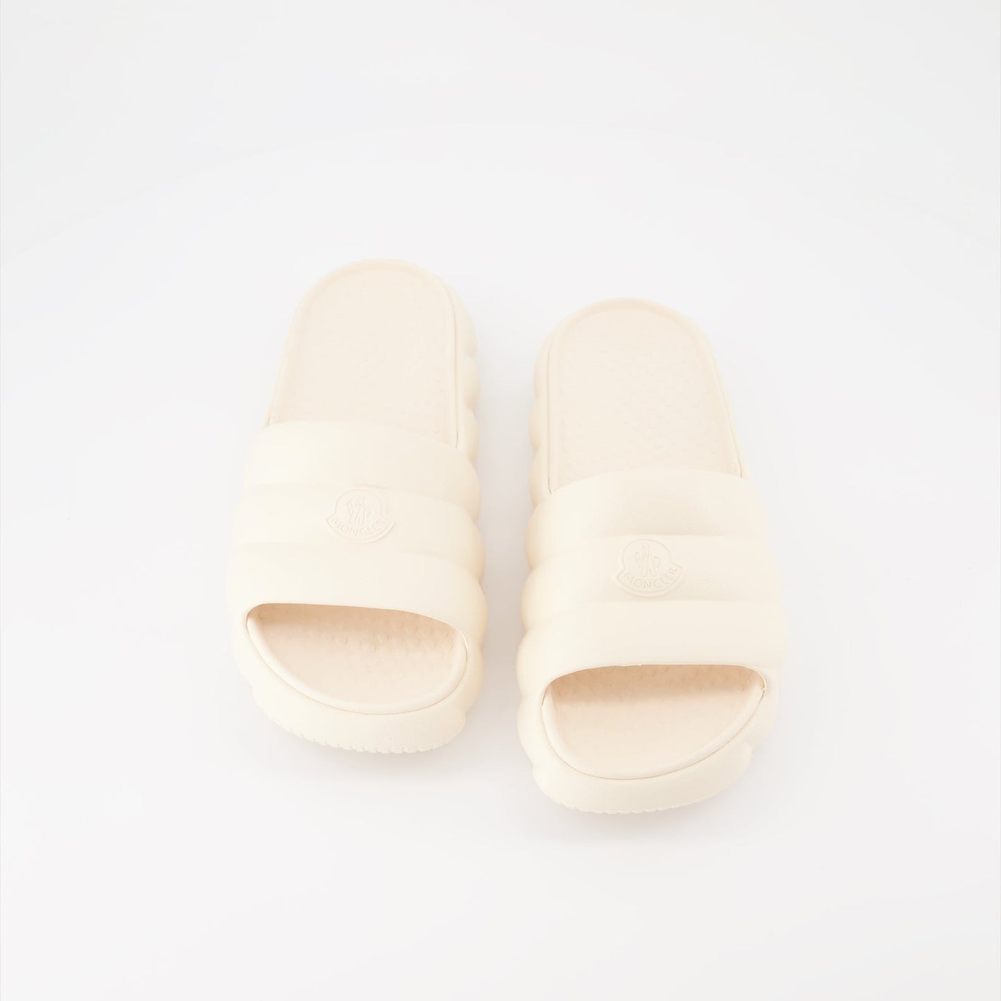 Moncler slides, luxury women's footwear, white slides, high-end fashion slides, designer casual shoes