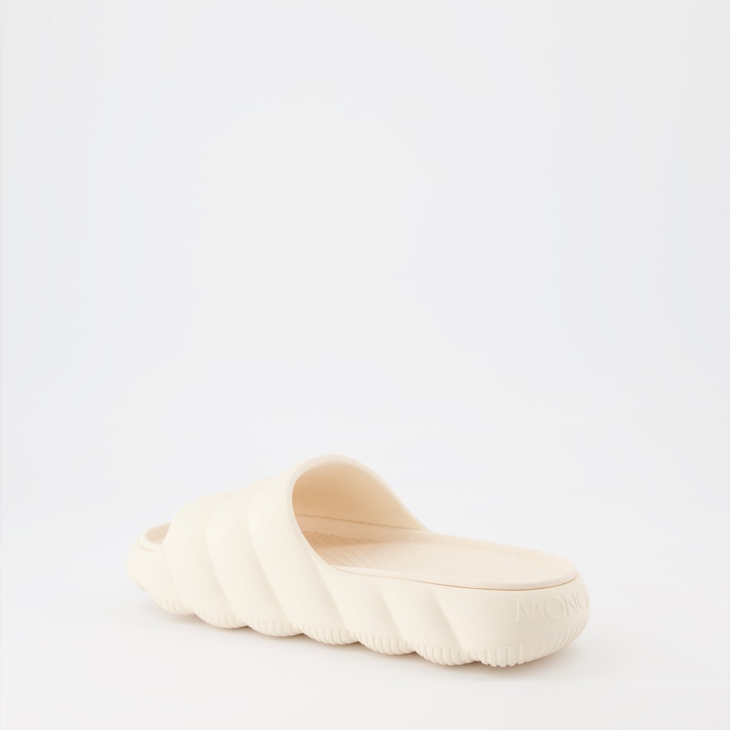 Moncler slides, luxury women's footwear, white slides, high-end fashion slides, designer casual shoes