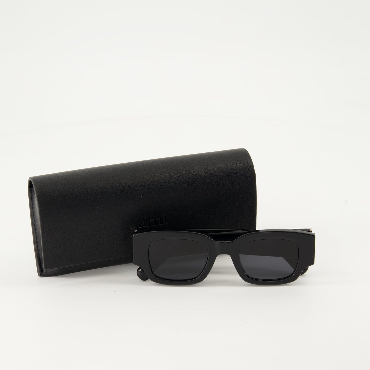 black sunglasses, AMI Paris, luxury eyewear, acetate frame, nylon lenses