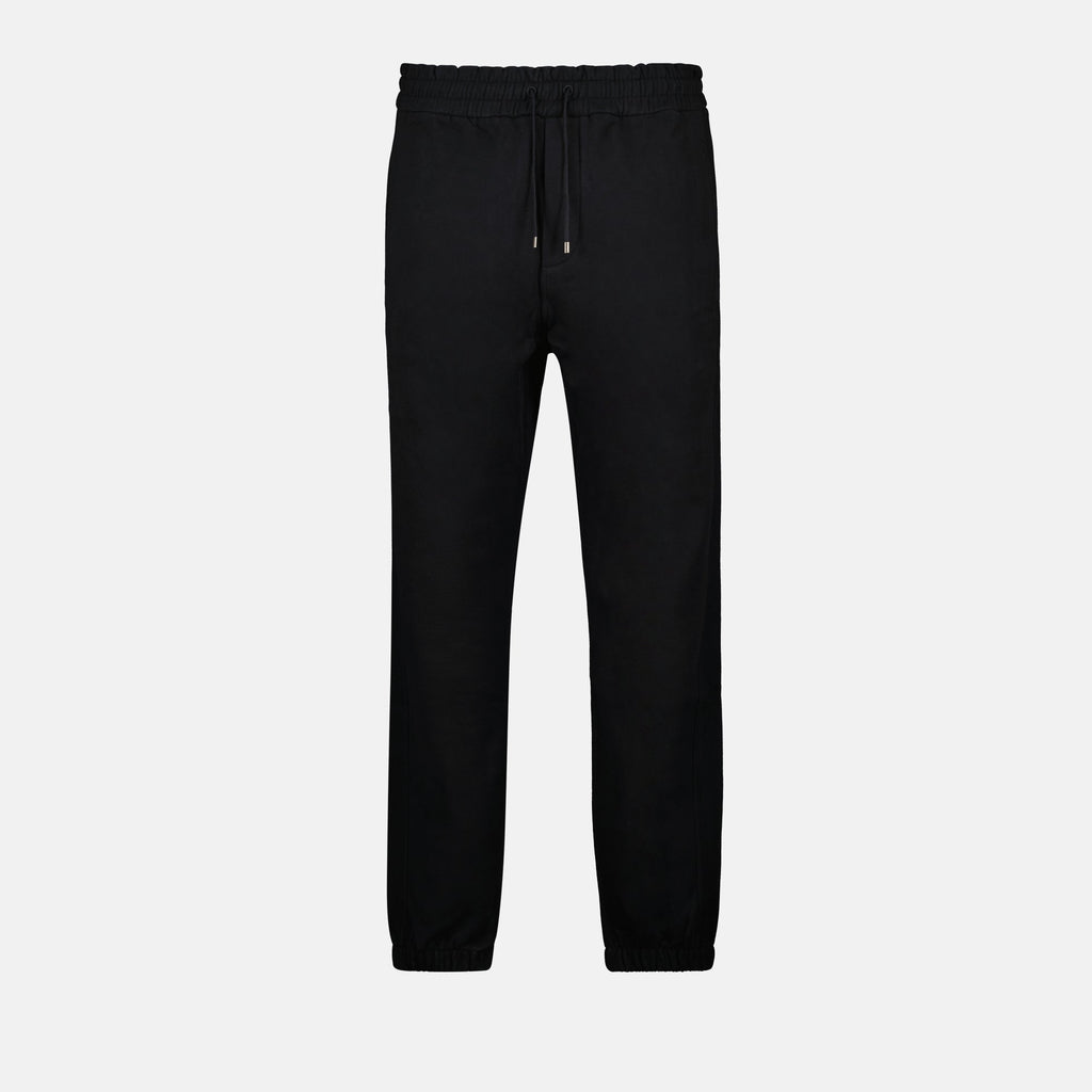 Image of Black Cotton Jogger Pants by Saint Laurent for Men - Season Autumn-Winter 2024 - Front View