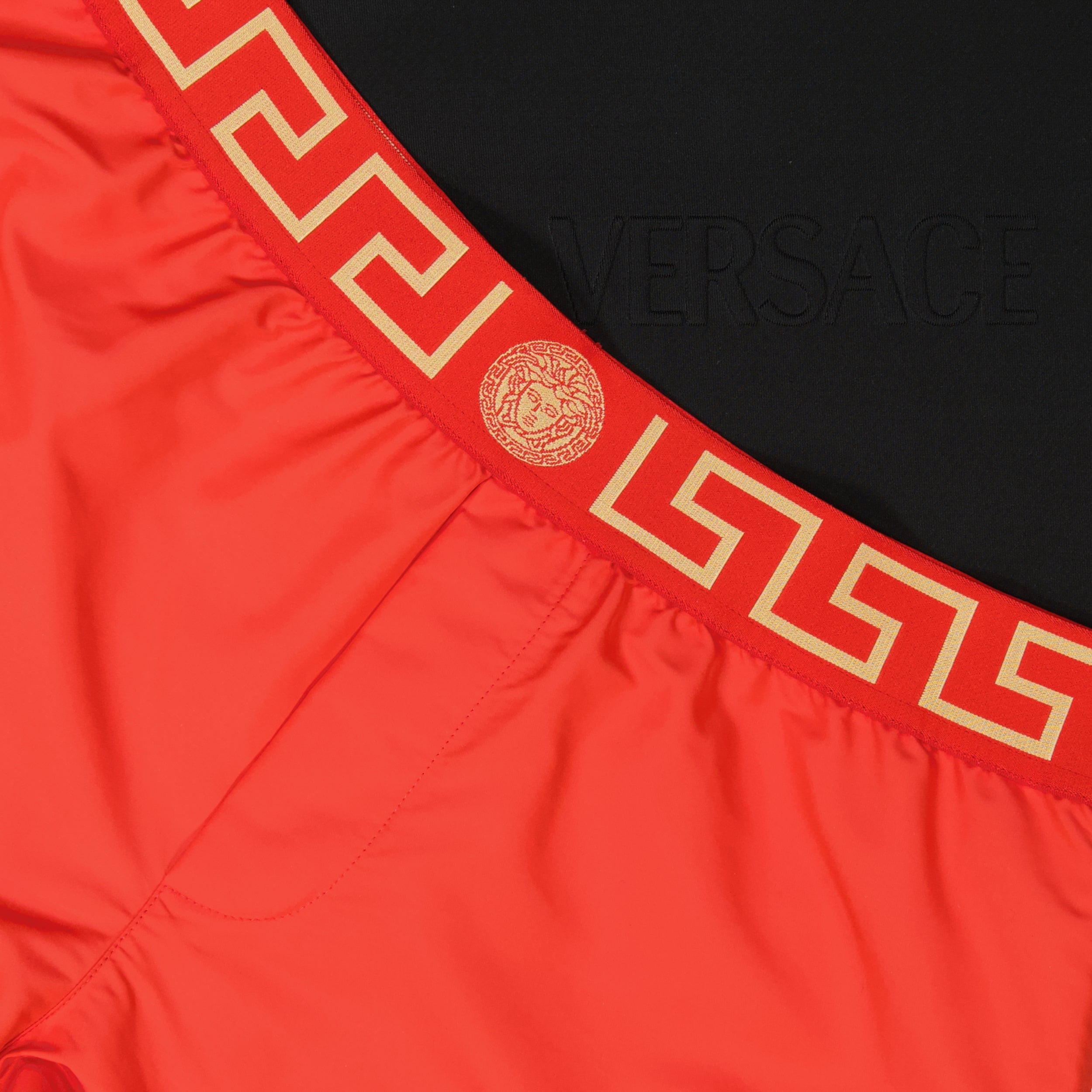 Versace swim shorts, Medusa Greca emblem, men's swimwear, red swim shorts, luxury beachwear