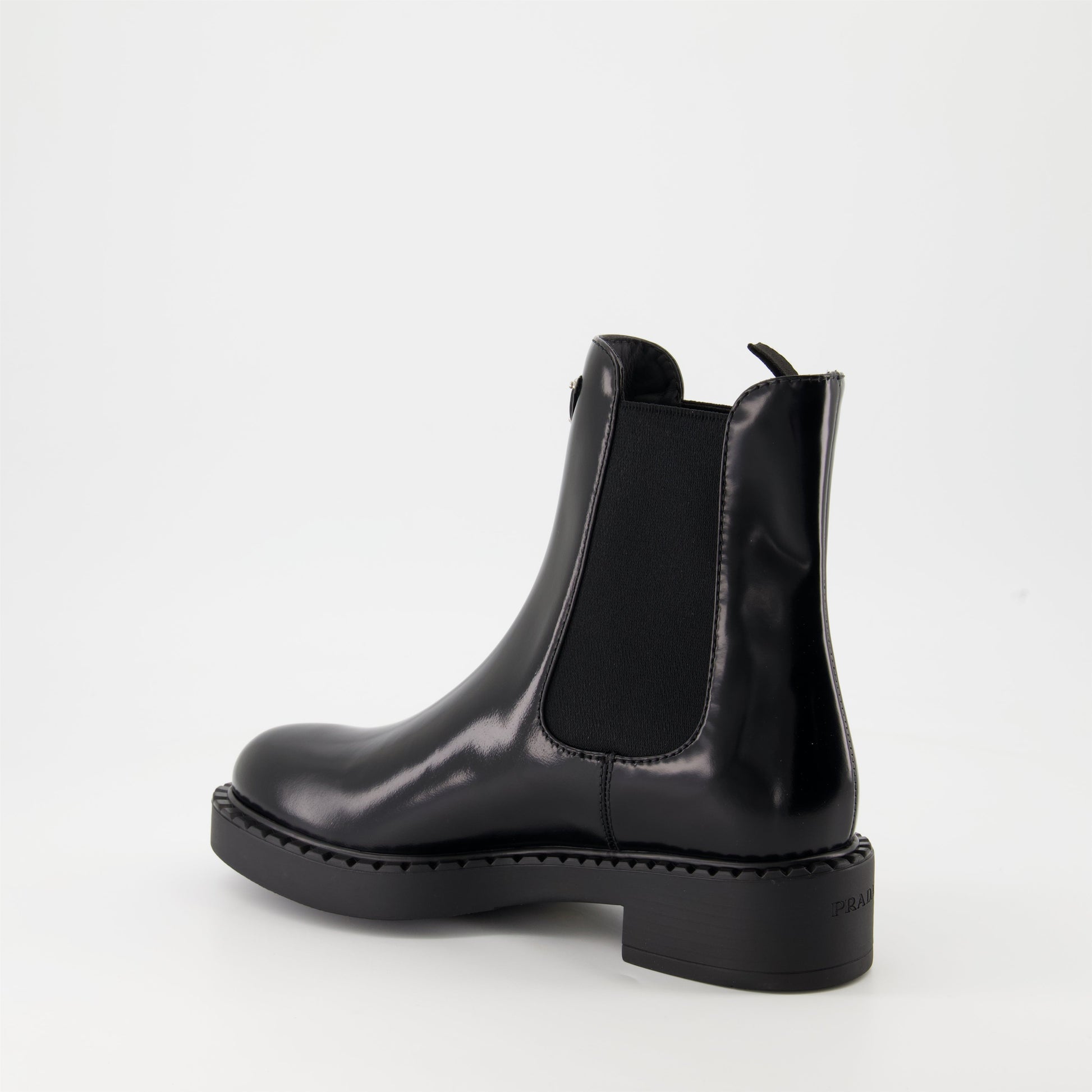   Patent leather boots, Prada ankle boots, black patent shoes, luxury footwear, autumn-winter collection.