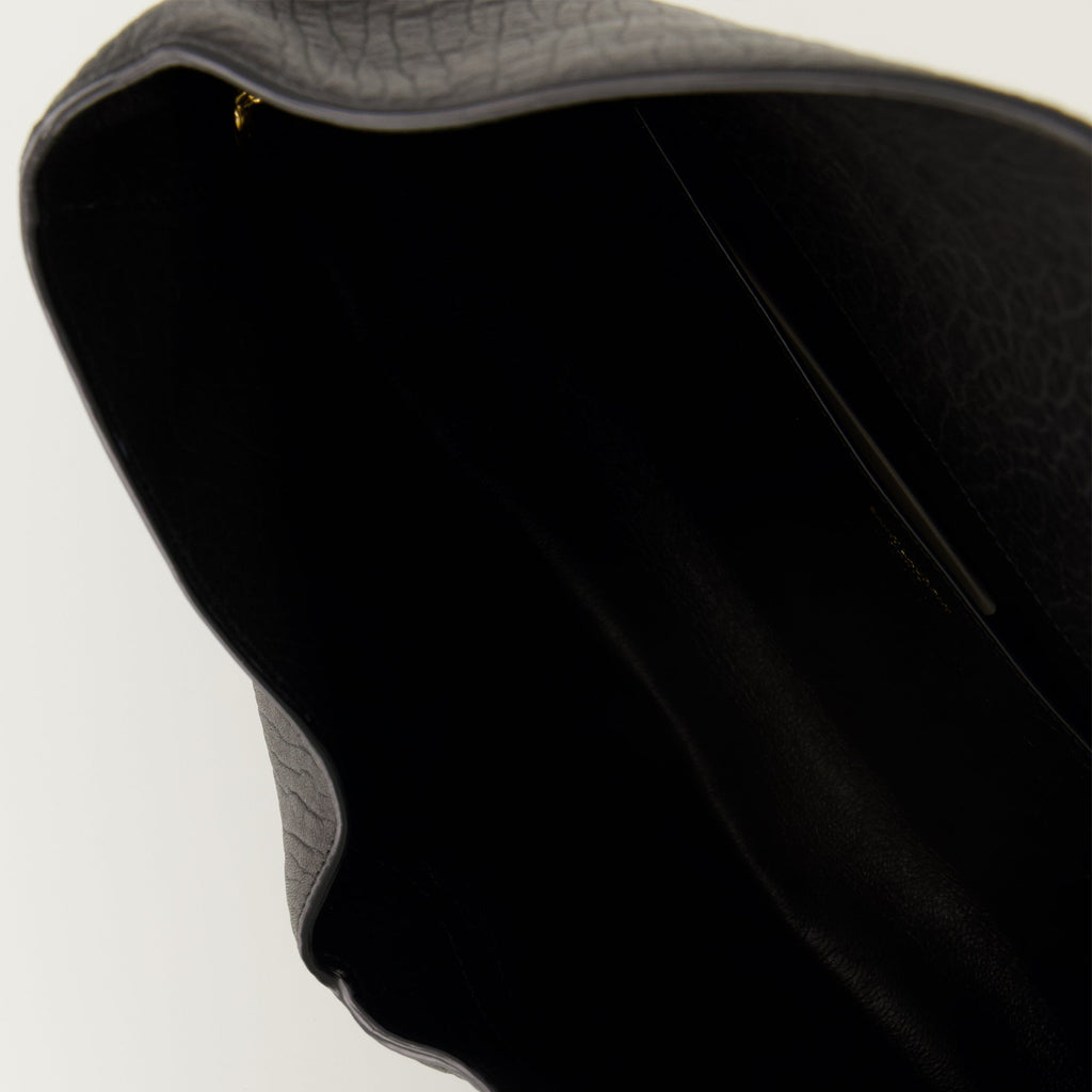 Saint Laurent clutch, black lambskin bag, Cassandre XXL, luxury leather accessory, designer clutch