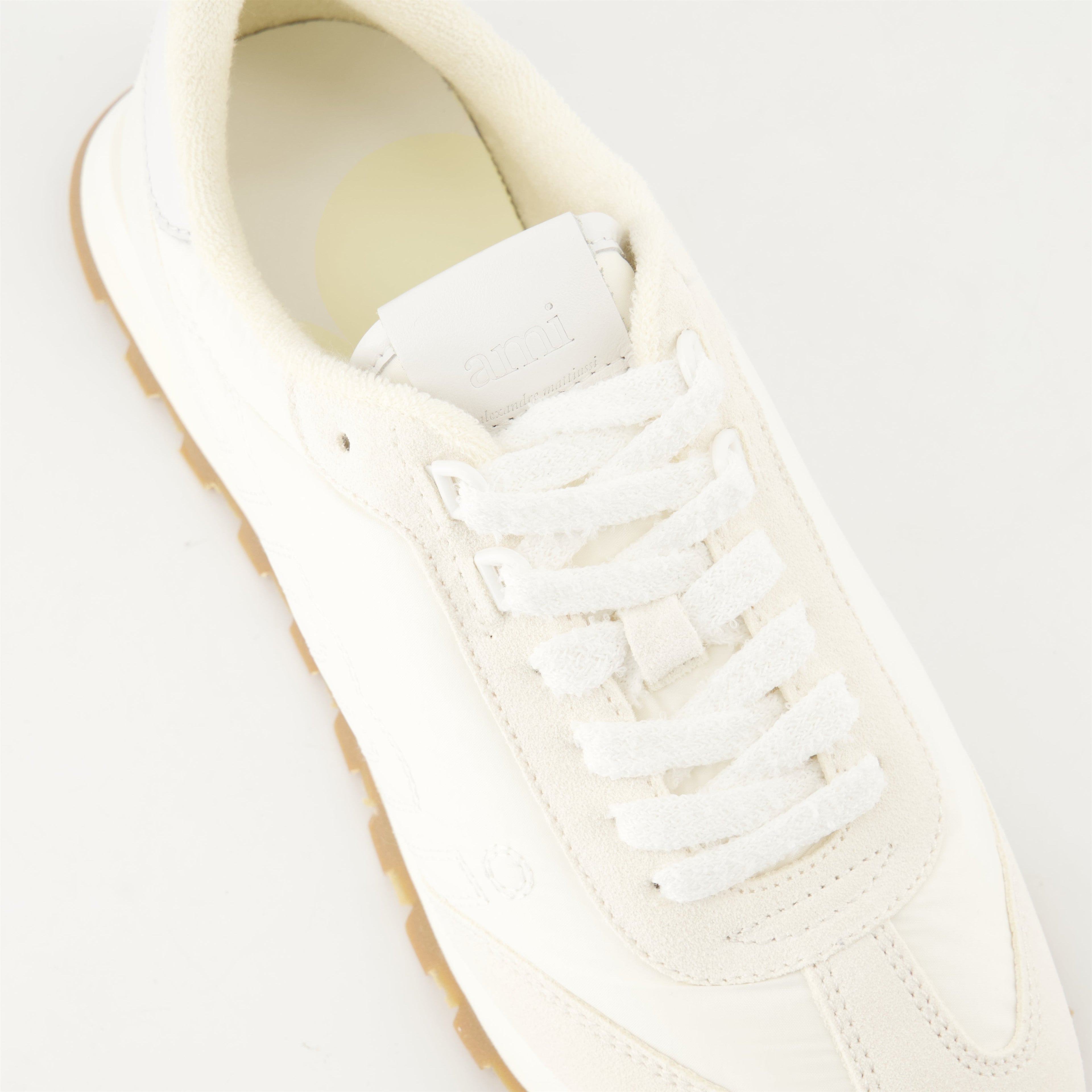 AMI New Rush sneakers, white sneakers, unisex footwear, leather sneakers, contemporary style