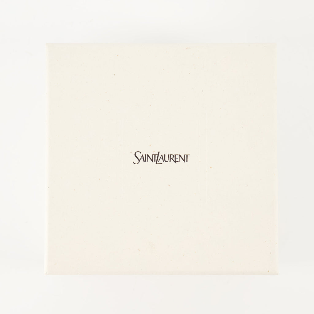 Cassandre cuff, Saint Laurent, gold cuff, brass accessory, metallic logo