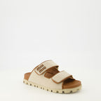 Image of Miu Miu Beige Canvas Mules by Miu Miu for Women - Season Spring-Summer 2026 - Front Right Three-Quarter View