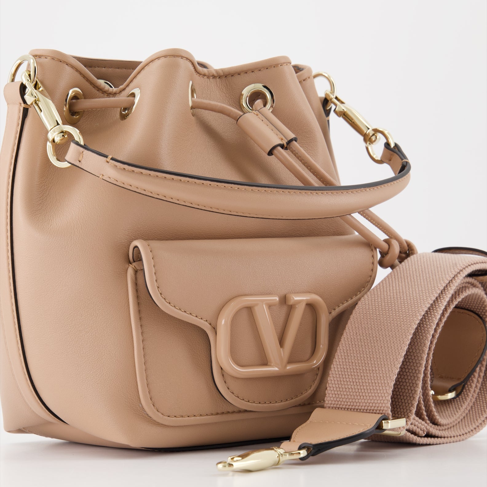   
Pink bucket bag, luxury handbag, Valentino Garavani bag, leather bucket bag, elegant accessories  
