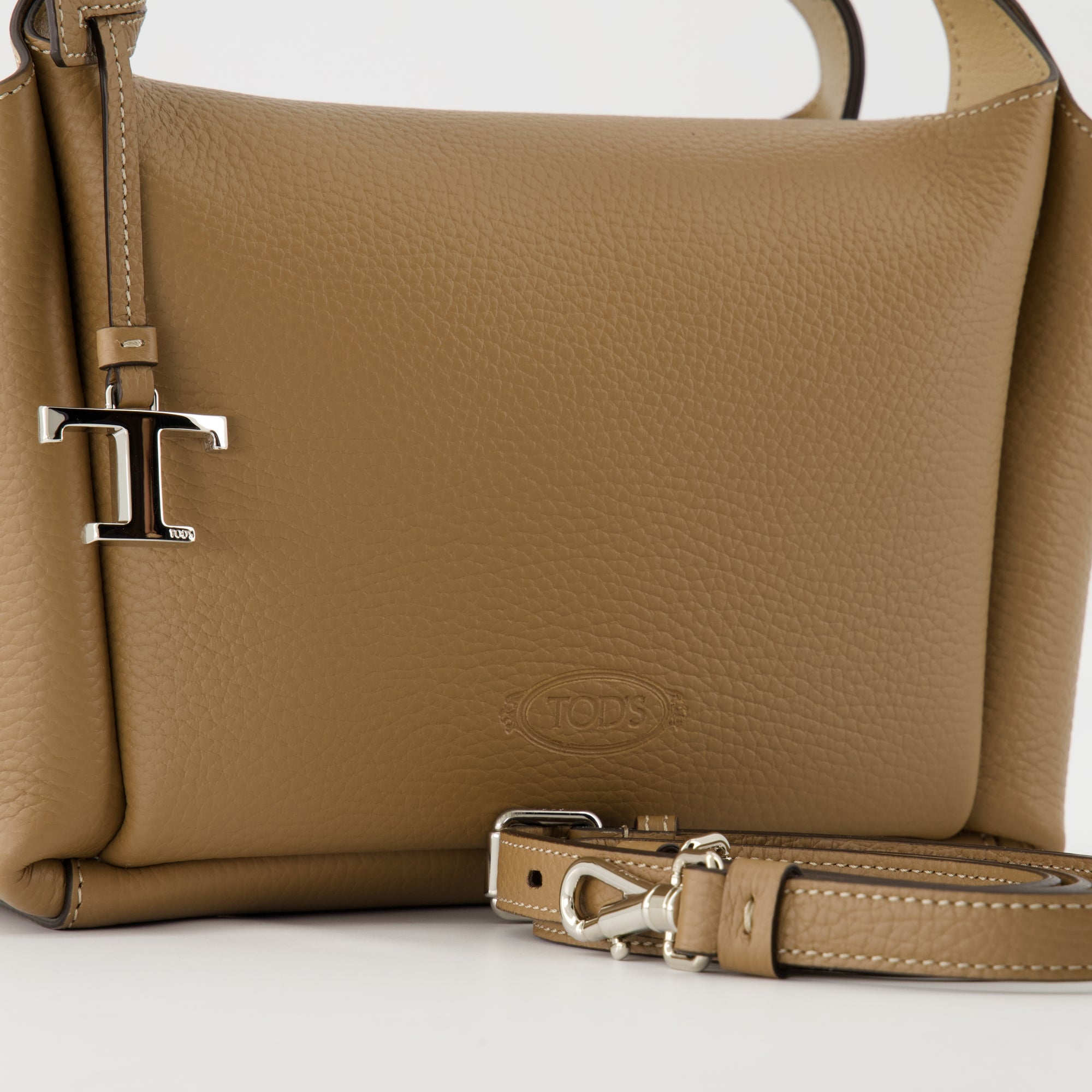 brown leather bag, Tod's Bauletto, stylish handbag, calf leather accessory, versatile bag