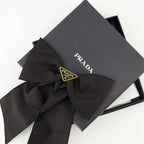 Prada barrette, Re-Nylon accessory, bow hair clip, sustainable fashion, black hair accessory