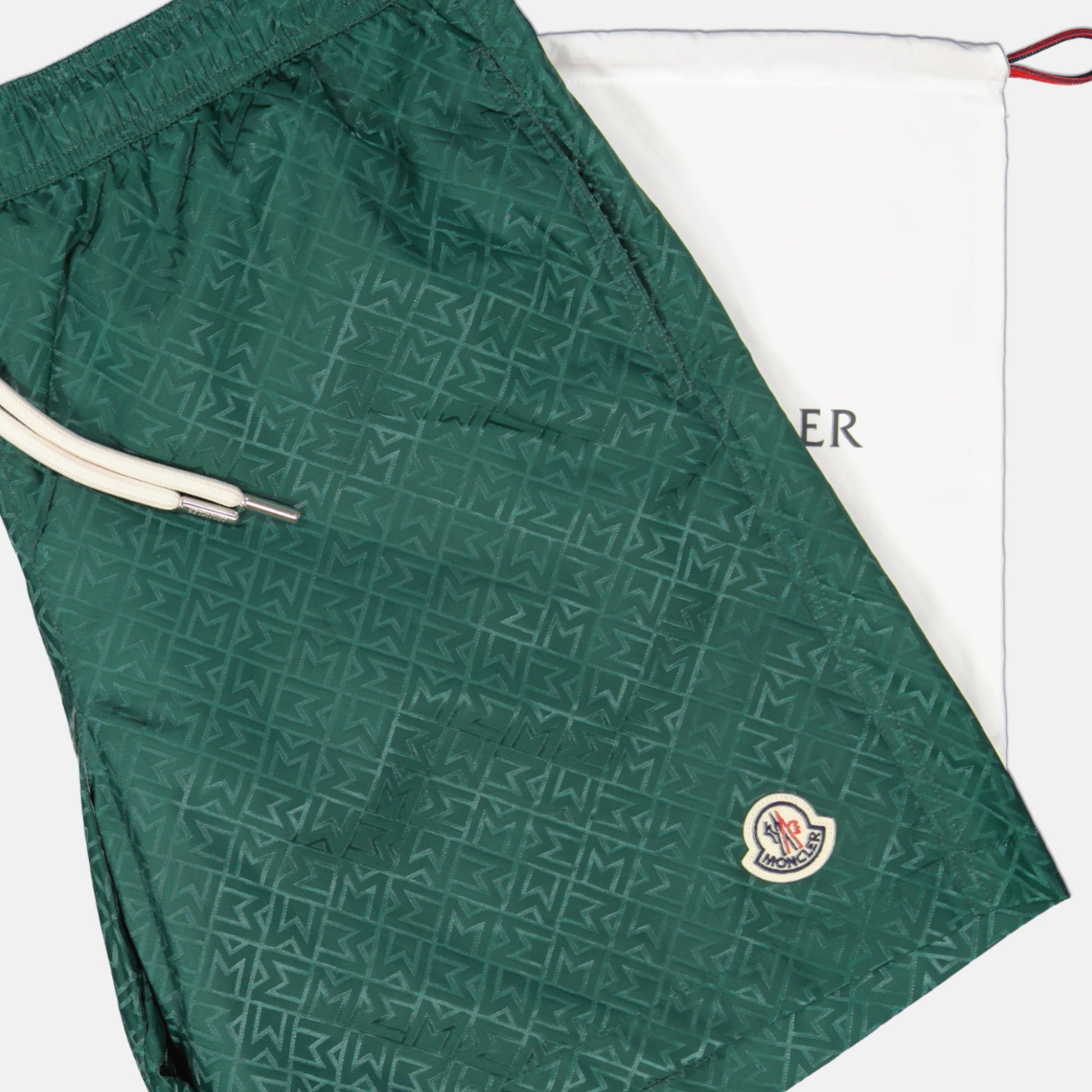 Monogram swim shorts, Moncler swimwear, green swim shorts, sustainable swimwear, jacquard nylon shorts