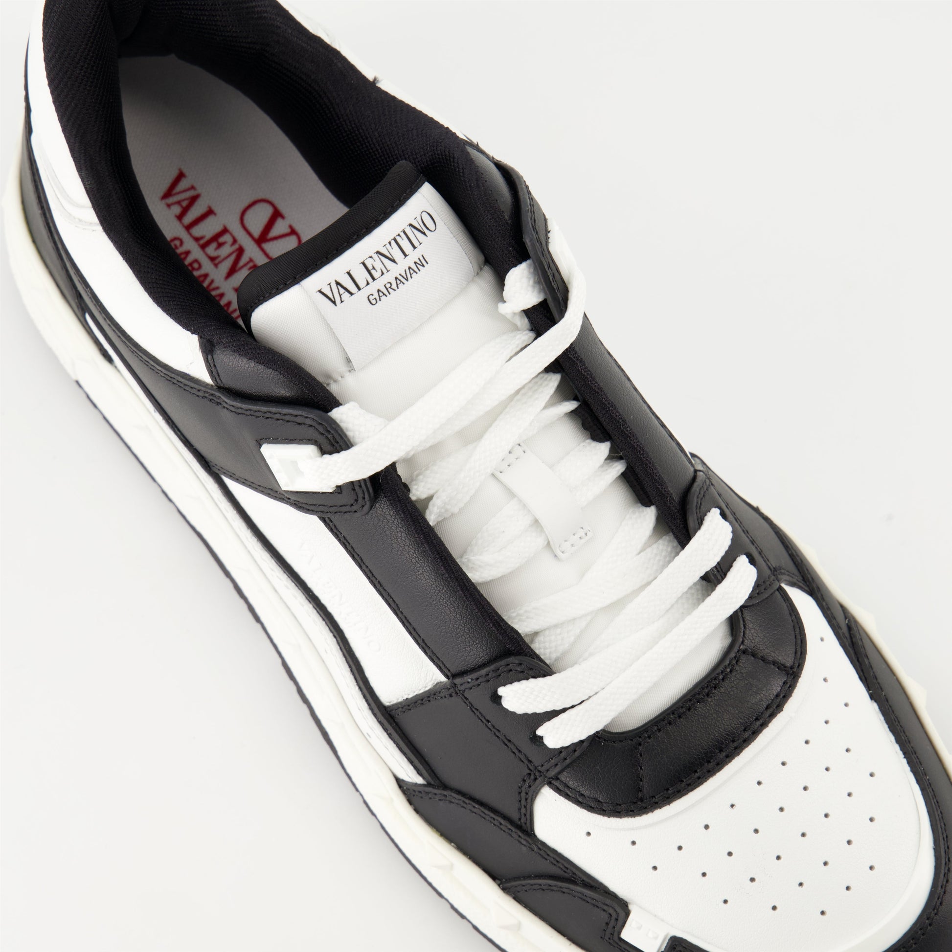 Valentino Garavani sneakers, black and white leather sneakers, luxury footwear, designer sneakers, high-end fashion