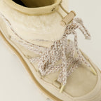 Image of Peak Beige Shearling Boots by Moncler for Women - Season Autumn-Winter 2025 - Top Detail View