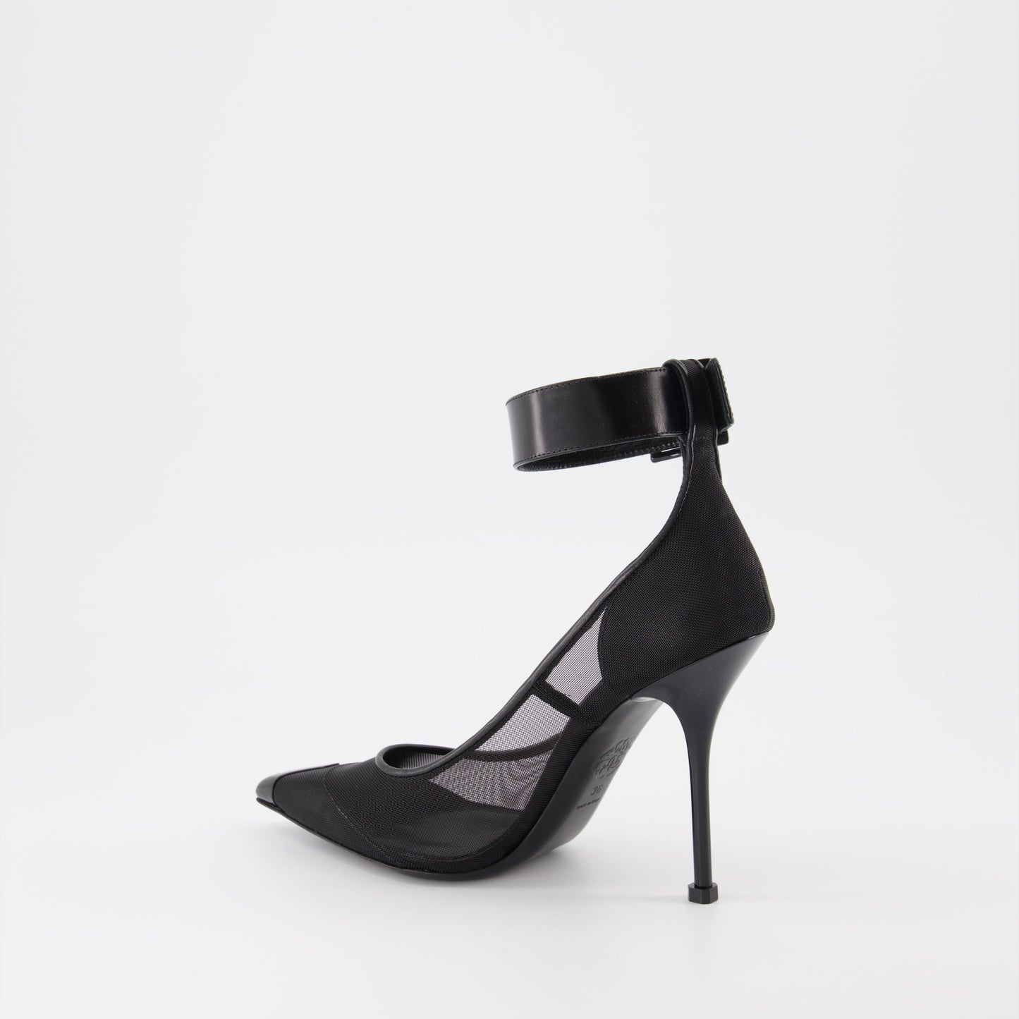 Alexander McQueen heels, black punk strap heels, luxury women's shoes, designer strap heels, high-end stilettos