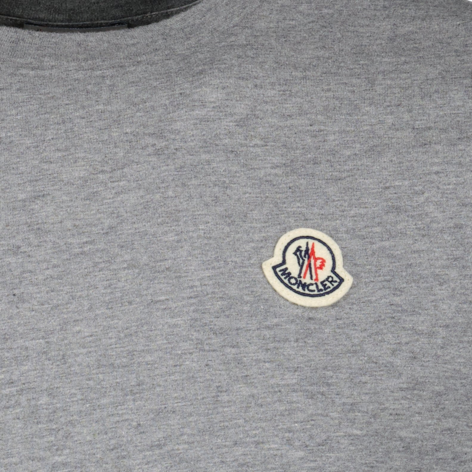 Cotton t-shirts, Moncler logo tees, casual essentials, three-pack shirts, premium cotton wear