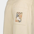 Imagem de Calças de Jogging Beige Cavalier da Burberry para Mulheres - Temporada Primavera-Verão 2025 - Vista do Detalhe do Produto 2