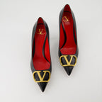   Valentino Garavani, black leather pumps, pointed-toe shoes, high-end fashion, luxury footwear