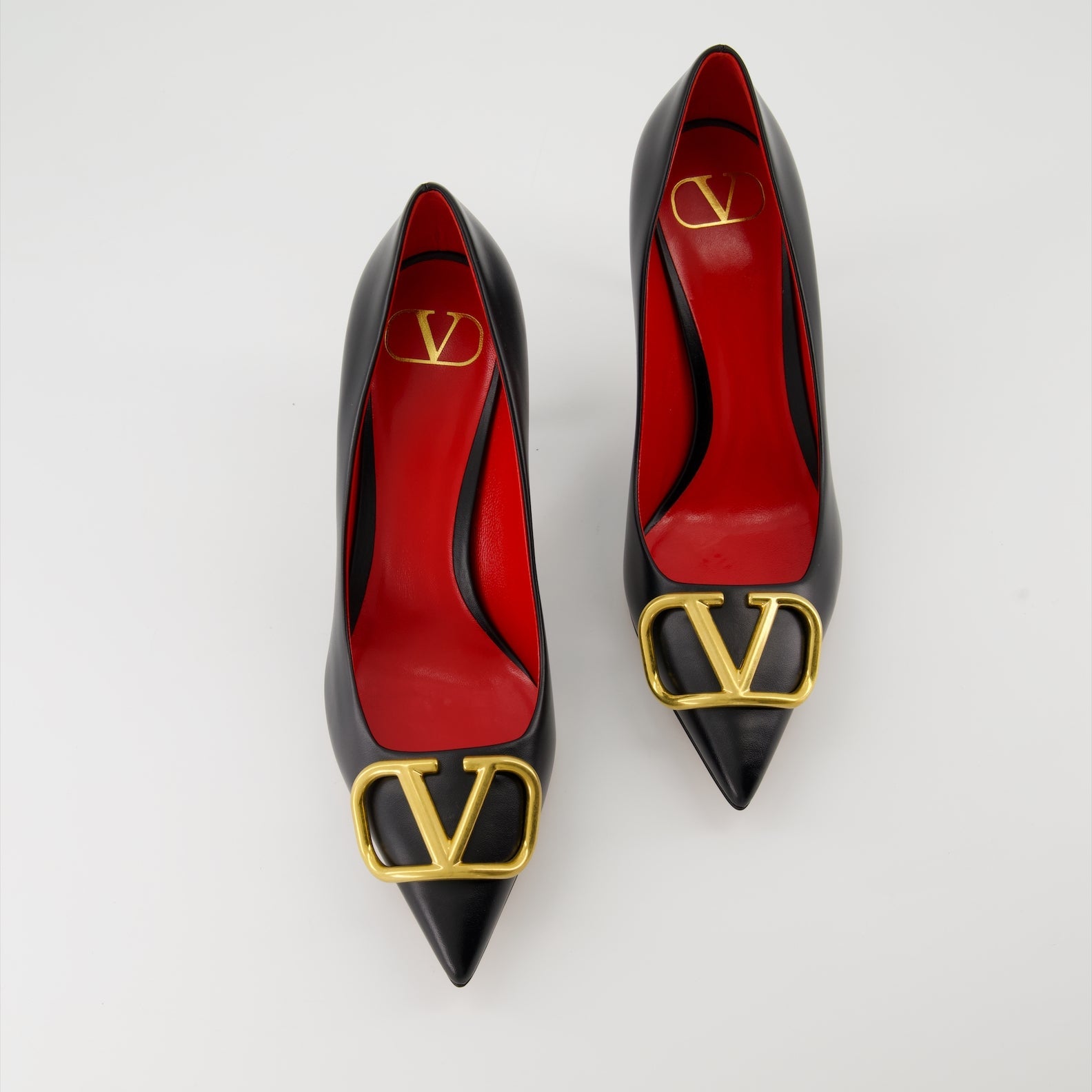   Valentino Garavani, black leather pumps, pointed-toe shoes, high-end fashion, luxury footwear