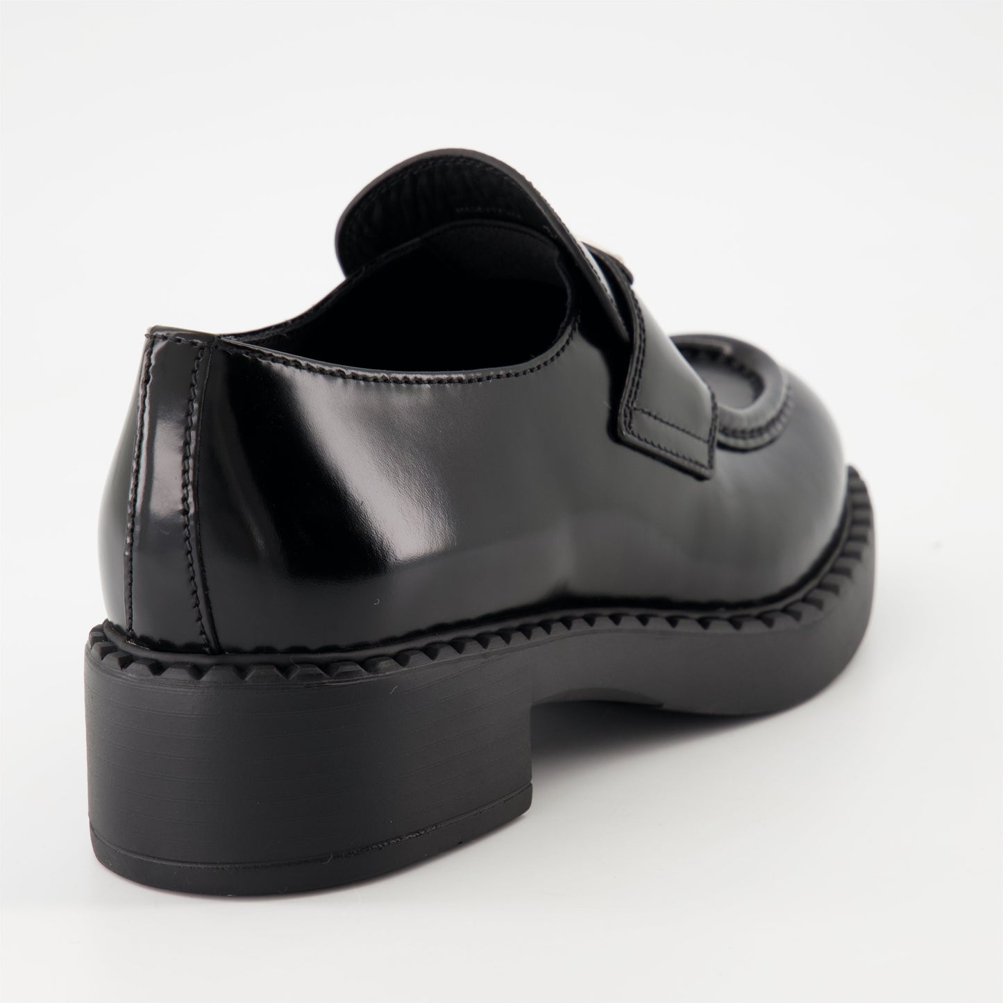 patent leather mocassins, luxury footwear, Prada AW24, black mocassins, elegant shoes