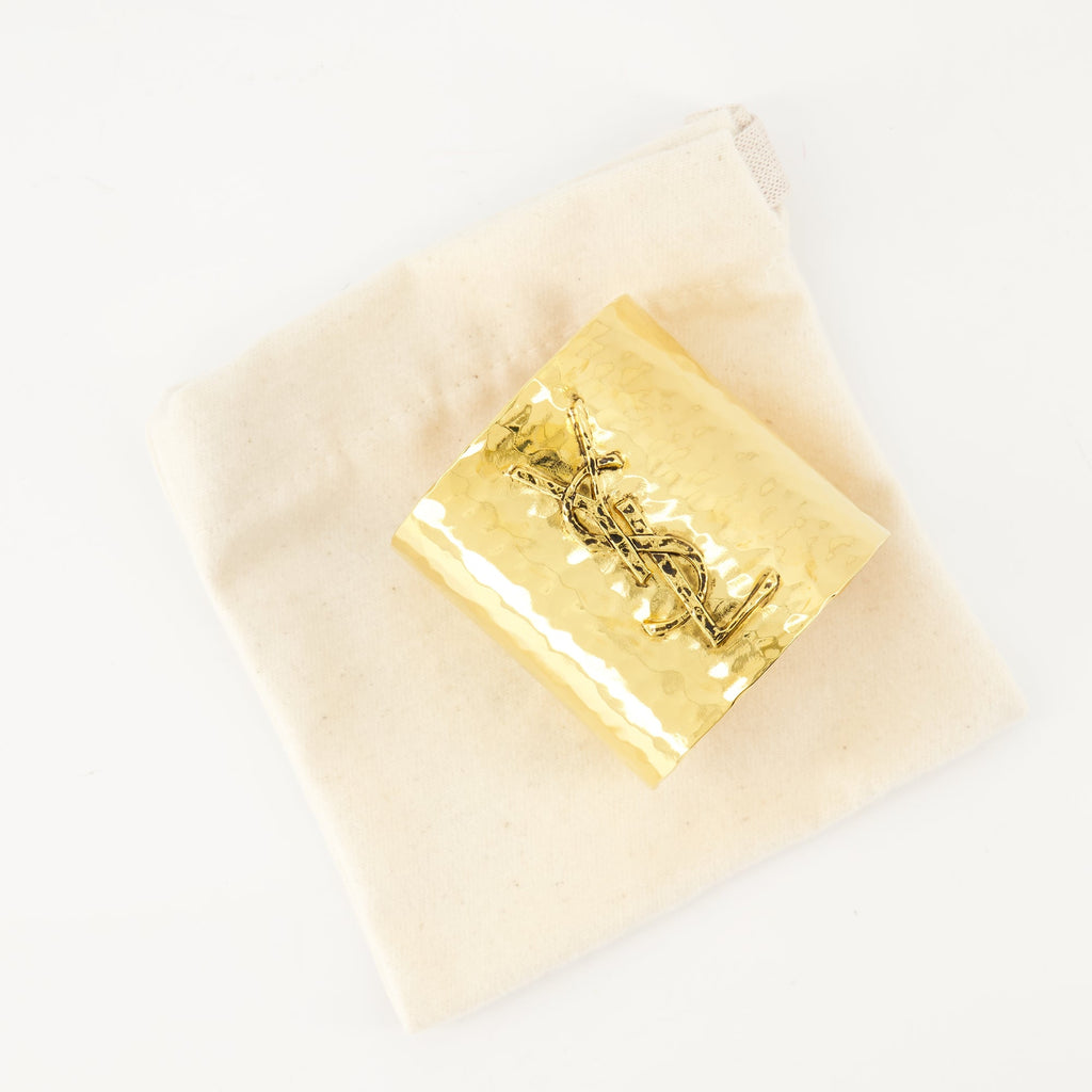 Cassandre cuff, Saint Laurent, gold cuff, brass accessory, metallic logo