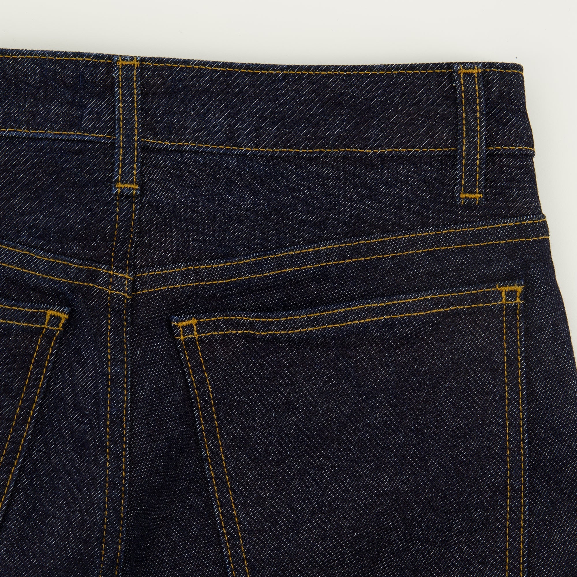 Khaite jeans, flare jeans, high-rise denim, deep blue jeans, five-pocket design
