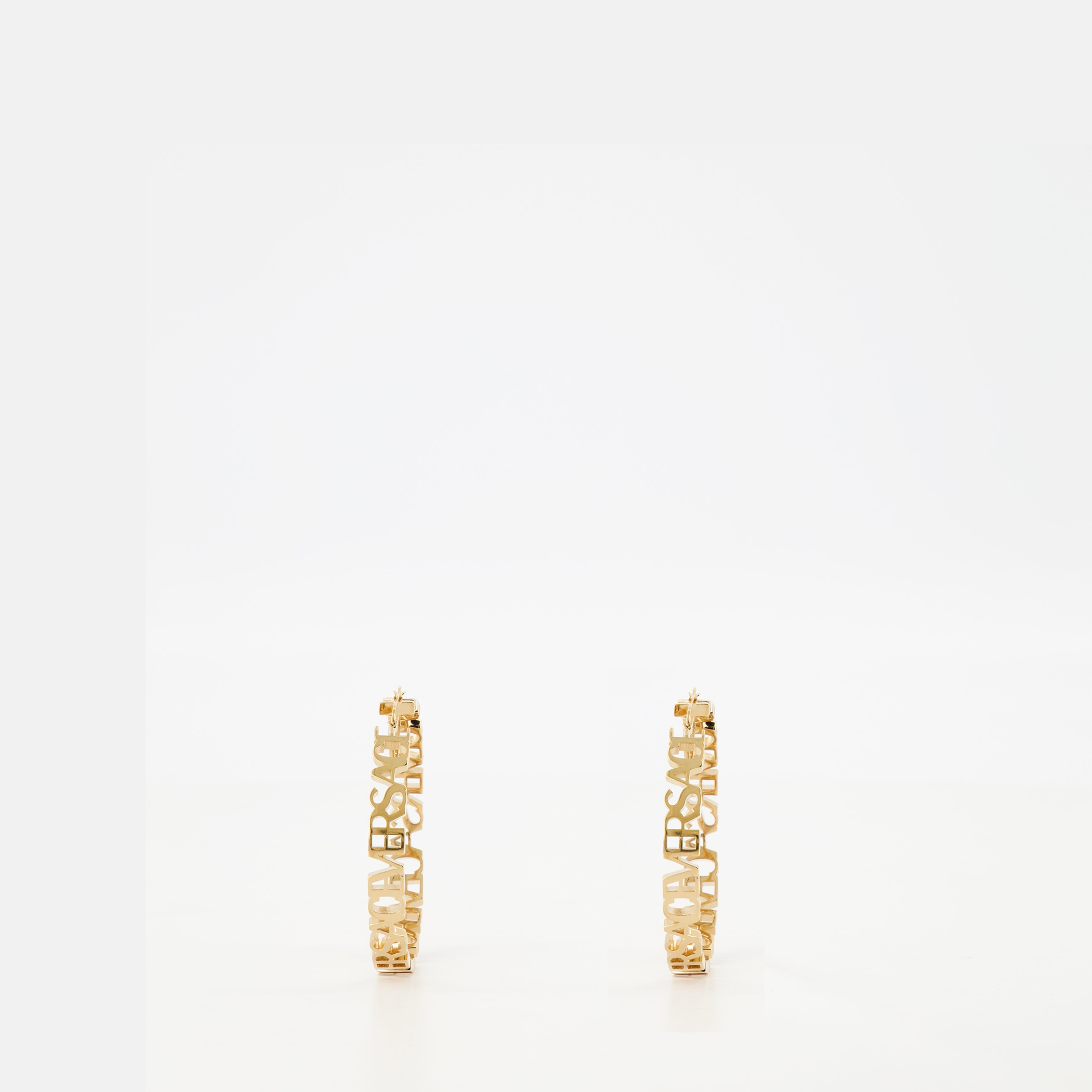 Gold hoop earrings, Versace jewelry, logo earrings, statement accessories, luxury earrings