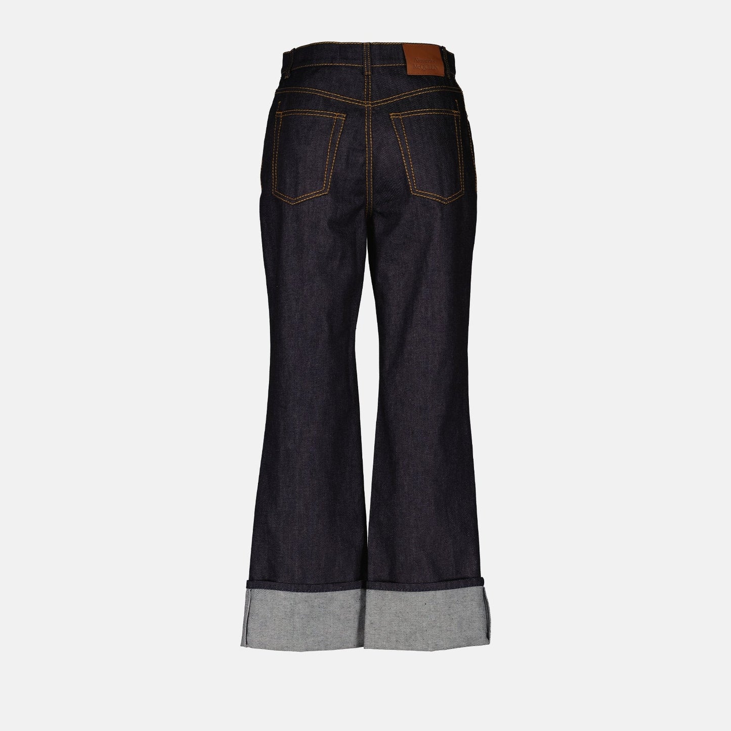 high-waisted jeans, Alexander McQueen jeans, luxury denim, women’s designer jeans, rolled cuff jeans