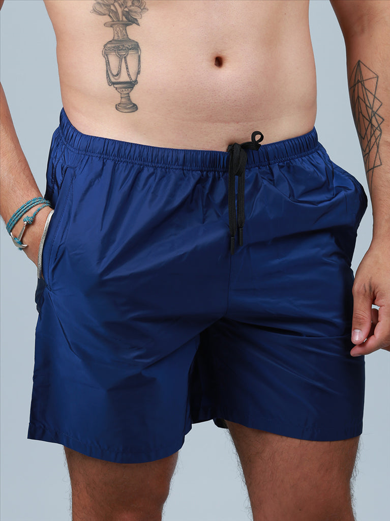 Prada swim trunks, luxury men's swimwear, blue swim shorts, high-end beachwear, designer swimwear