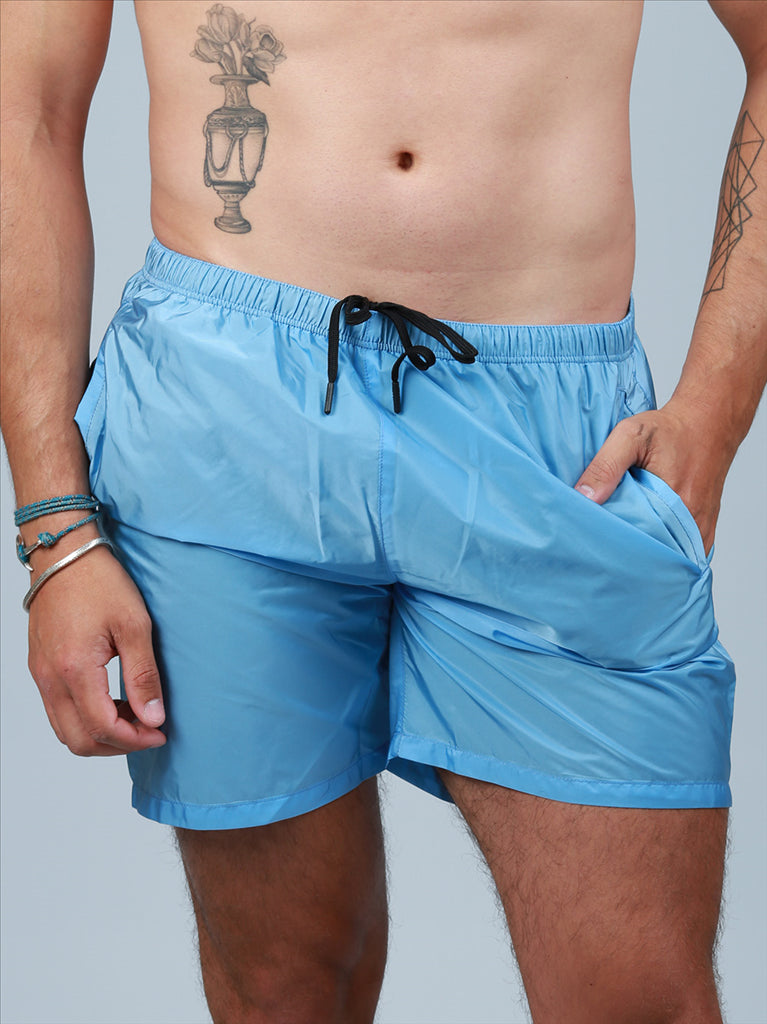 Prada swim trunks, luxury swimwear, men's blue trunks, designer swimwear, high-end summer fashion