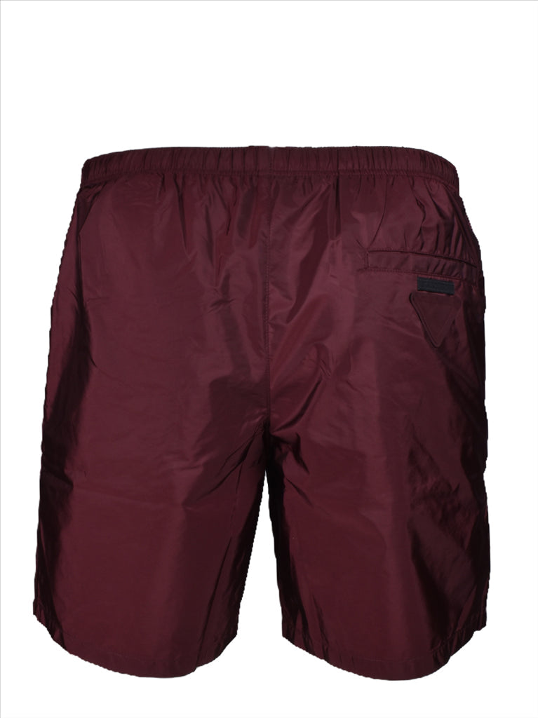 Prada swim shorts, luxury swimwear, bordeaux swim shorts, men’s designer swimwear, high-end swim shorts