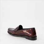 Patent loafers, tortoiseshell print, Saint Laurent, masculine elegance, luxury footwear