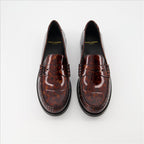 Patent loafers, tortoiseshell print, Saint Laurent, masculine elegance, luxury footwear