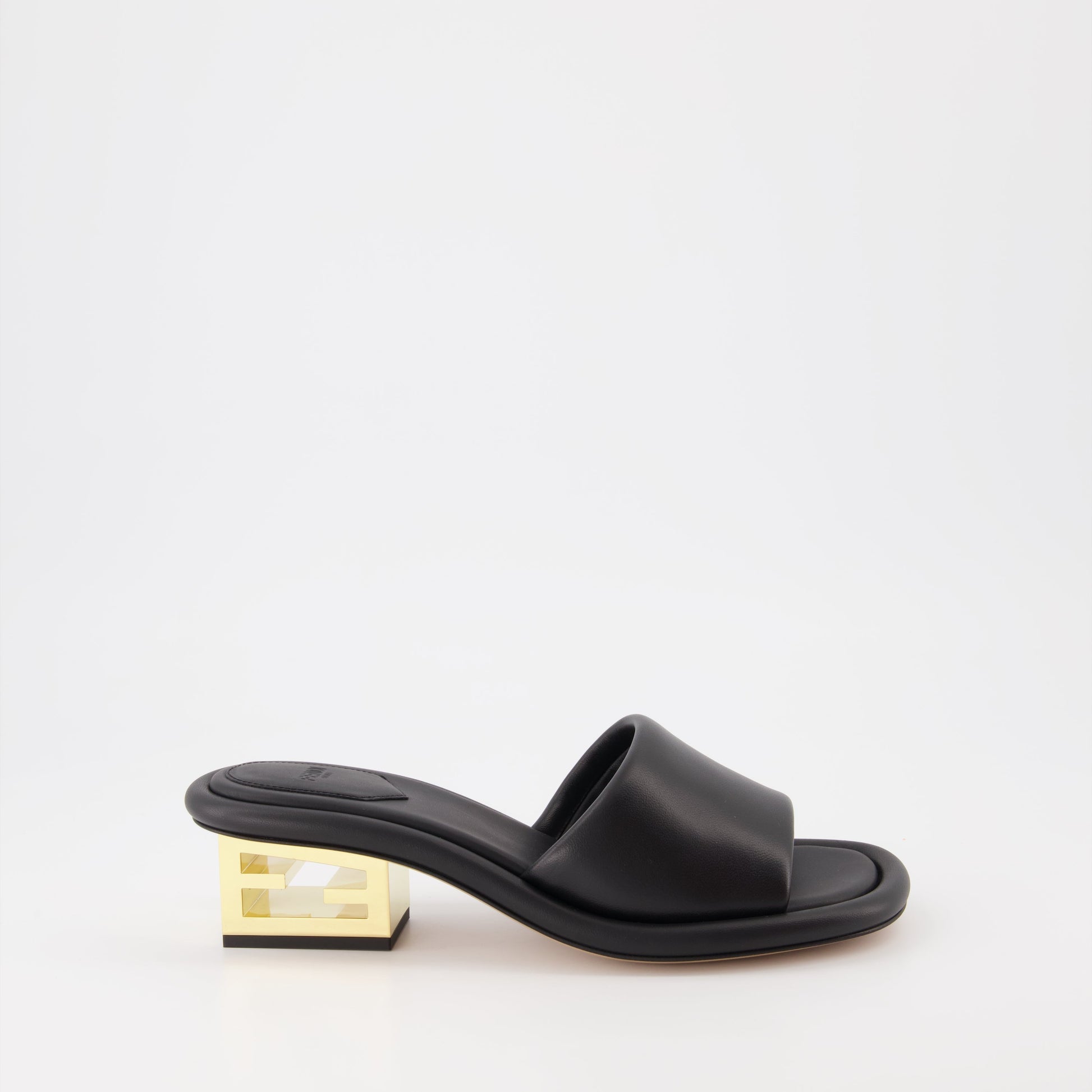 Fendi mules, black leather mules, luxury women's footwear, Fendi Baguette, designer women's shoes