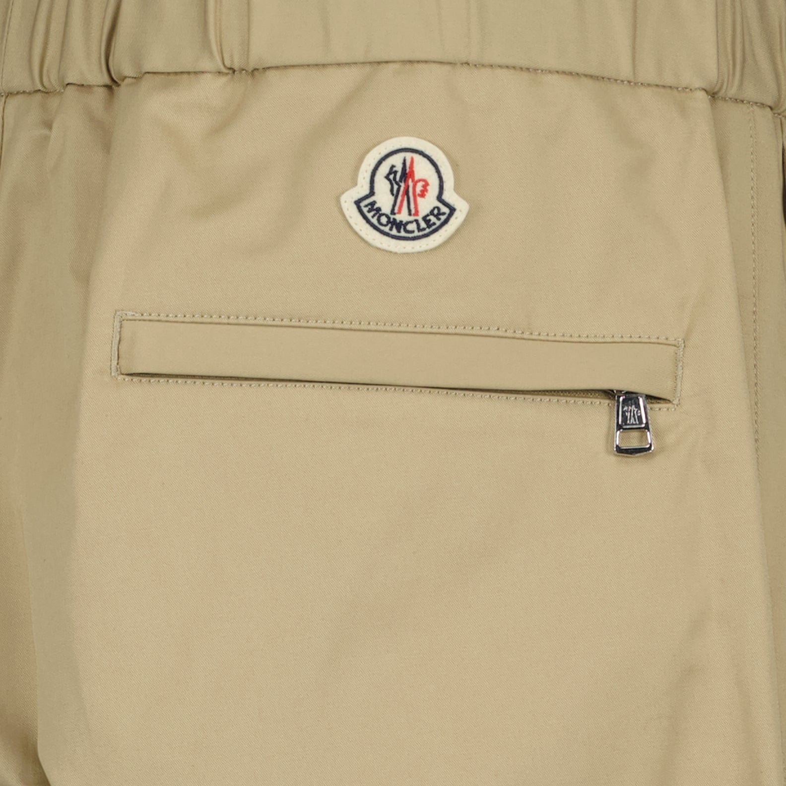 Moncler trousers, beige gabardine pants, luxury men's trousers, high-end fashion, Moncler menswear