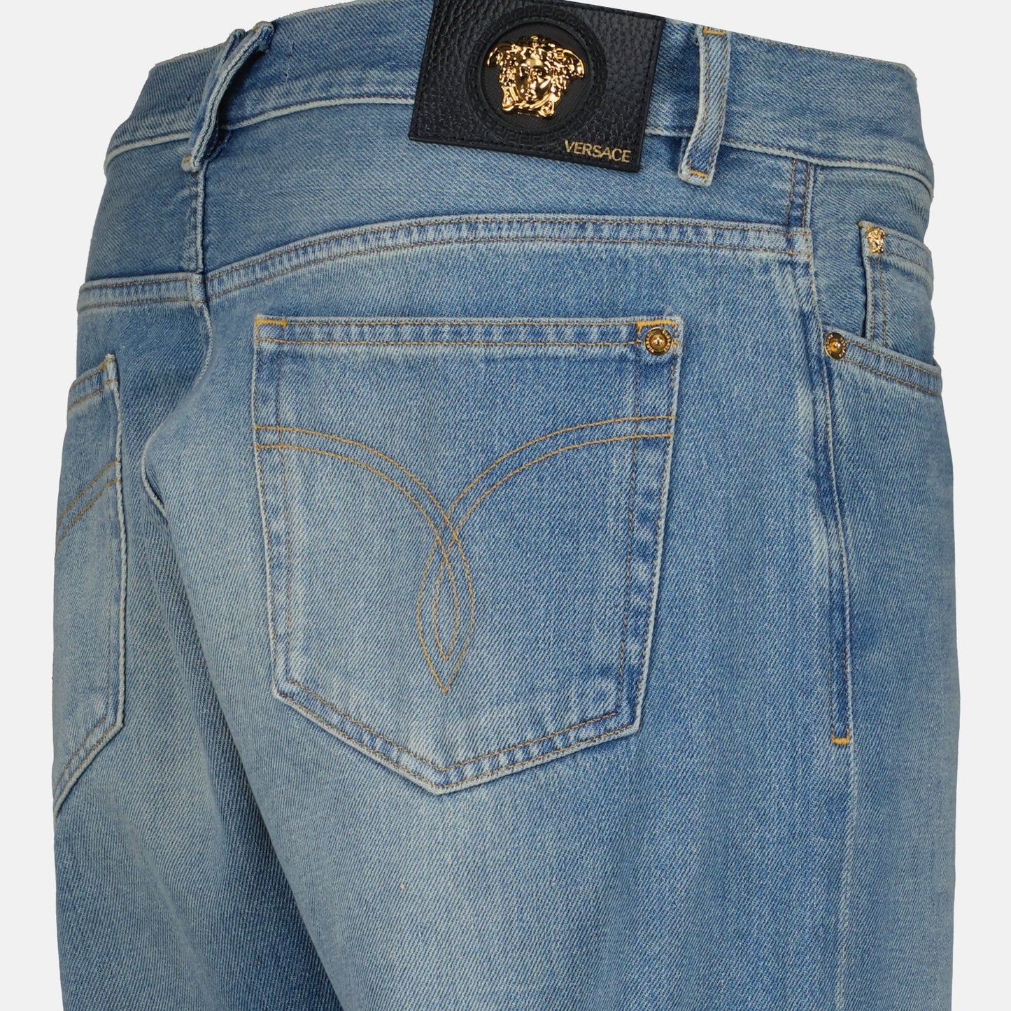 Versace men's jeans, luxury denim, light wash jeans, designer men's clothing, high-end fashion