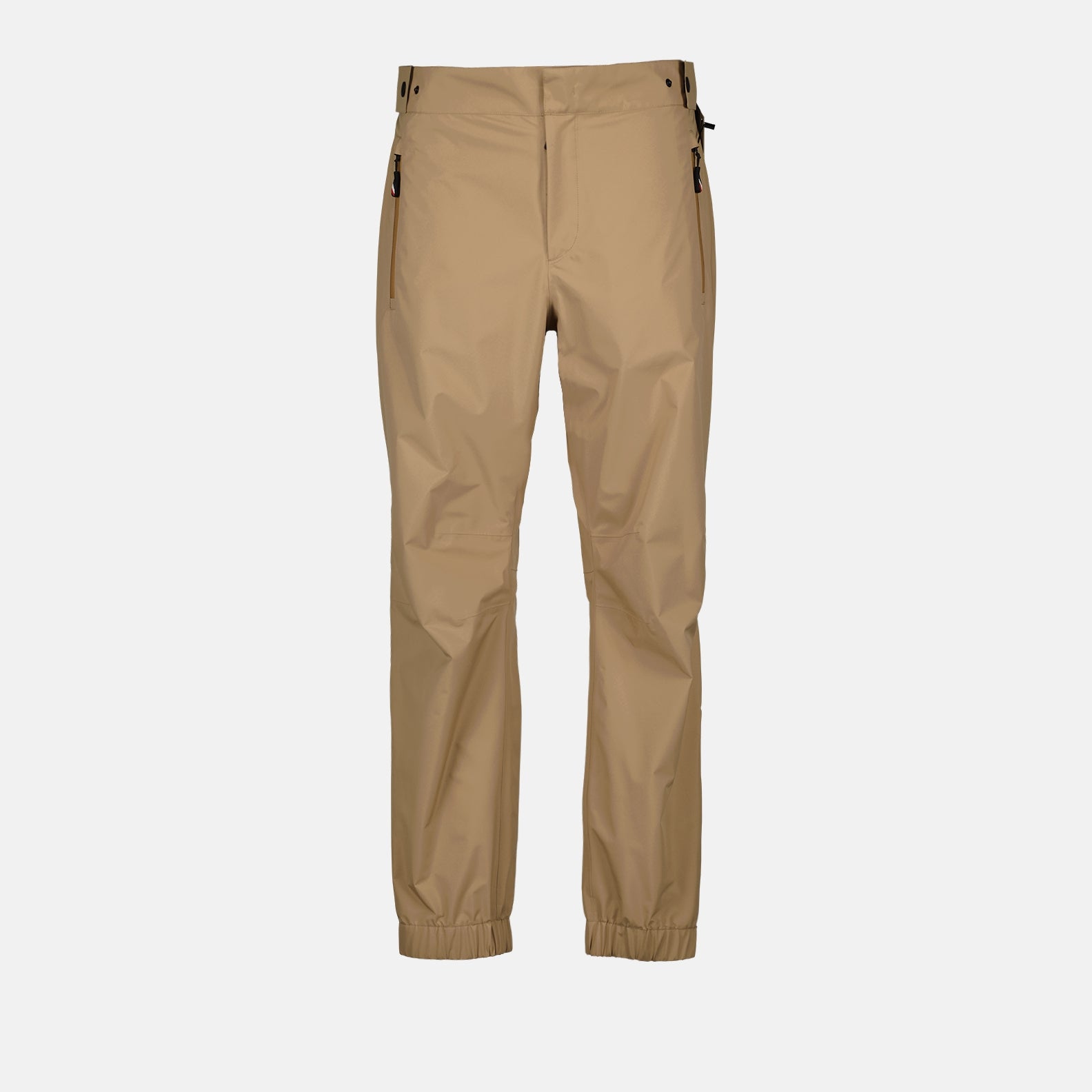  
Moncler Grenoble ski pants, luxury ski wear, beige ski pants, men's ski pants, high-end ski apparel  
**