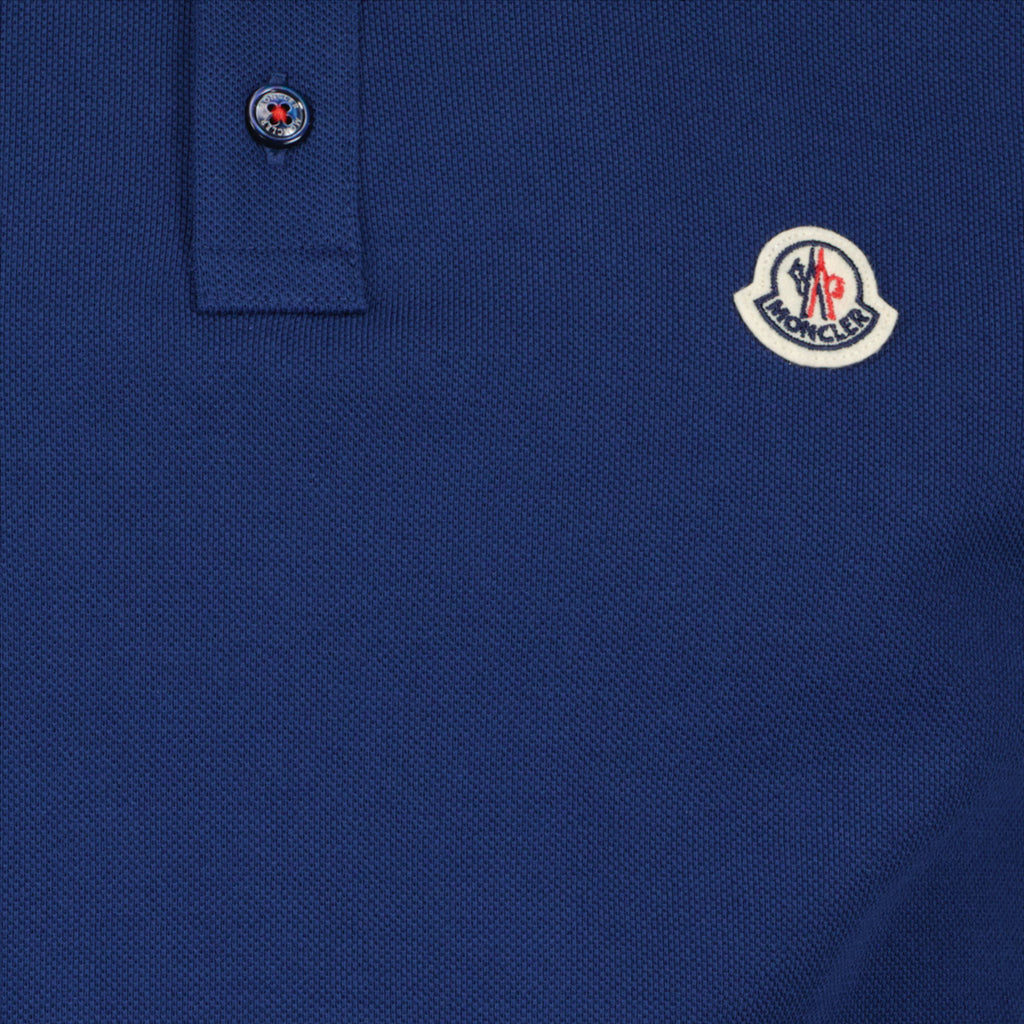 - Men's Moncler Polo
- Deluxe Navy Blue
- Piqué Cotton
- Trendy Logo
- Tailored Fit