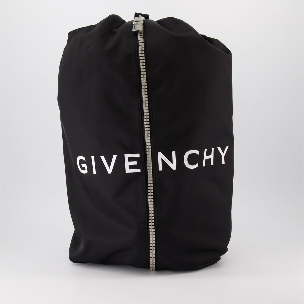 nylon backpack, adjustable straps, leather accents, front zip closure, silver-tone details