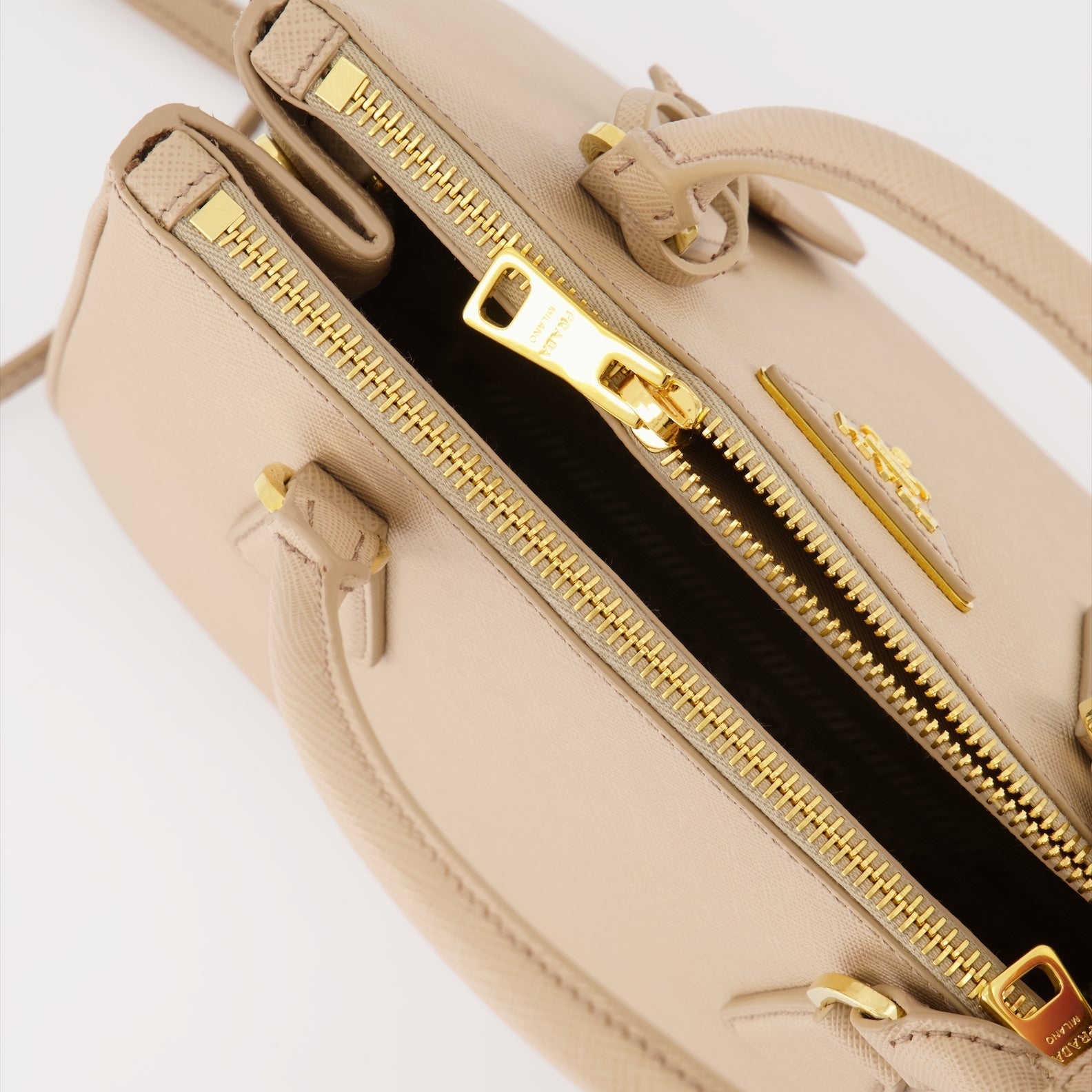 Prada handbag, Saffiano leather, luxury women's bag, beige handbag, high-end accessory