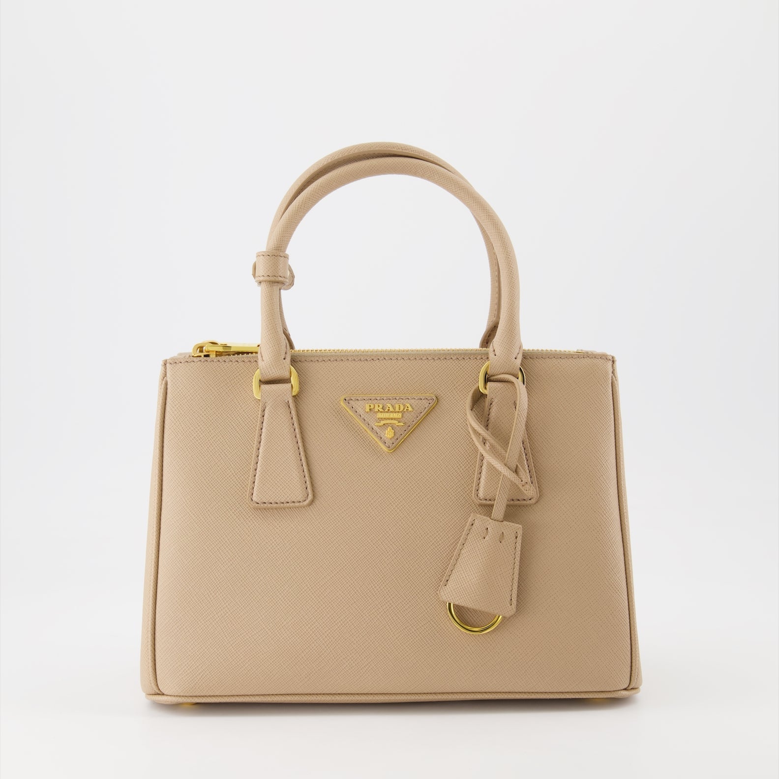 Prada handbag, Saffiano leather, luxury women's bag, beige handbag, high-end accessory